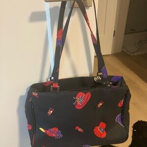 Stylish Black satchel with Red and Purple Hat Accents
